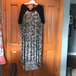 Women within black and white maxi dress